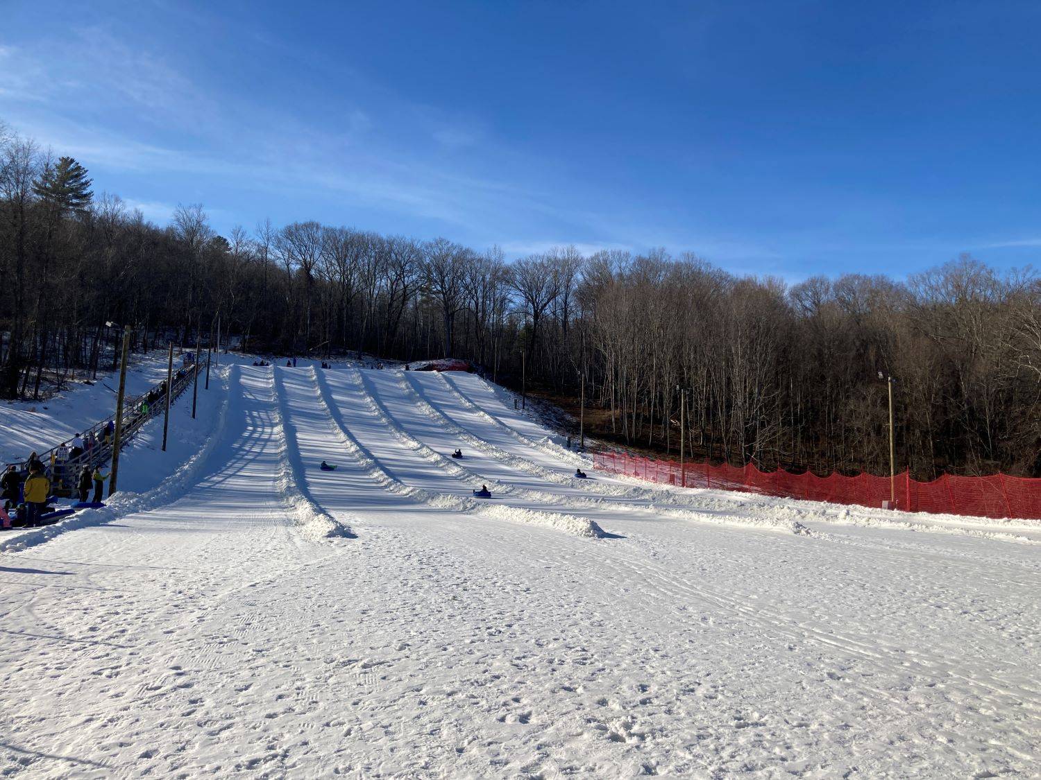 3 employees riding chairlift